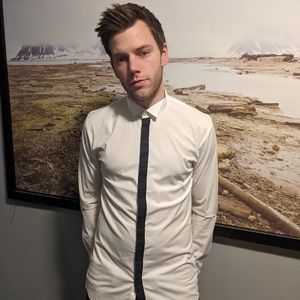 A button up Hugo Boss dress shirt with a back stripe down the middles